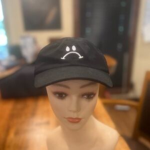 Frowny face ball cap in GUC